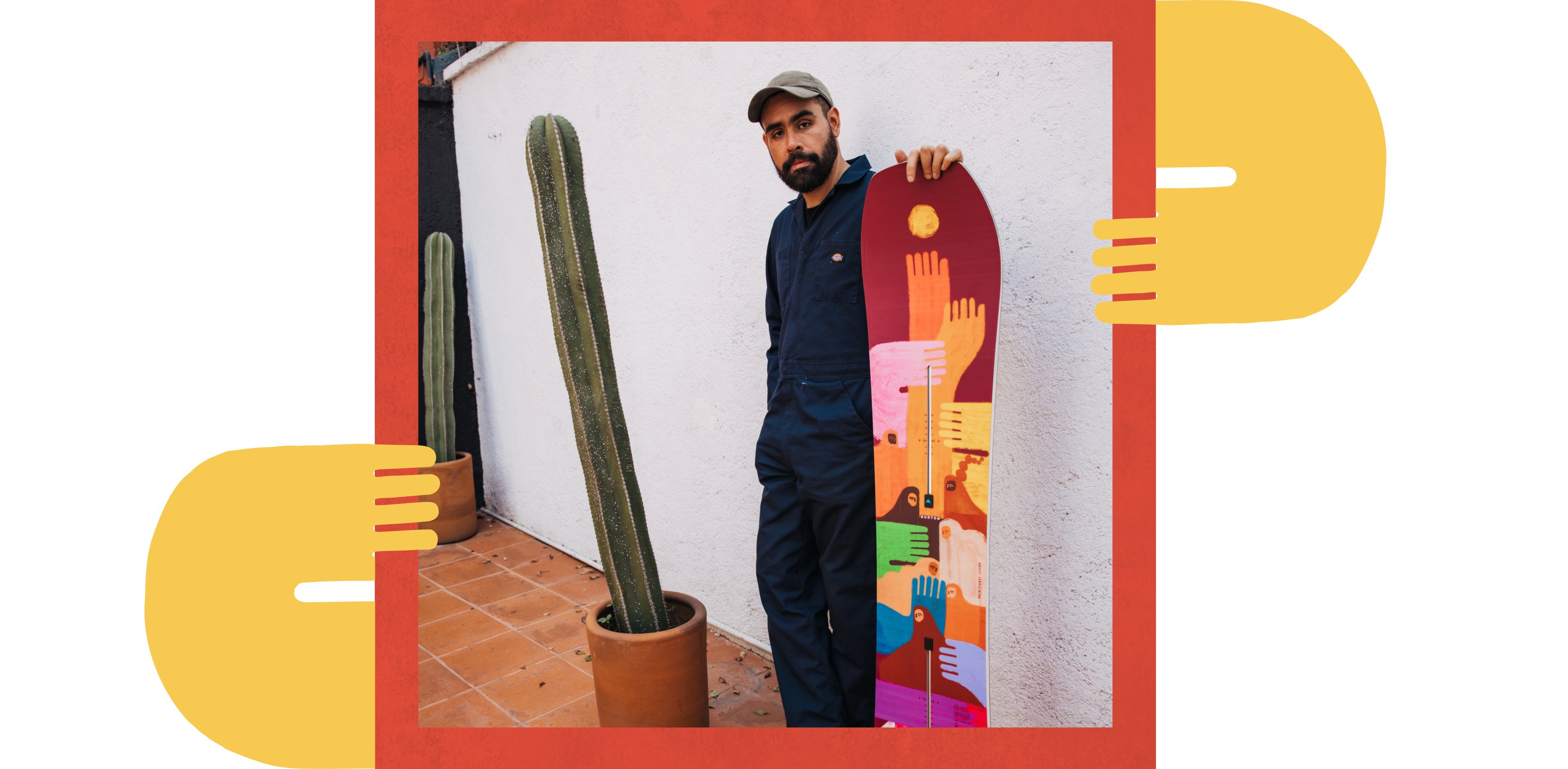 ENRIQUE LARIOS holding the Hometown Hero Snowboard with his artwork